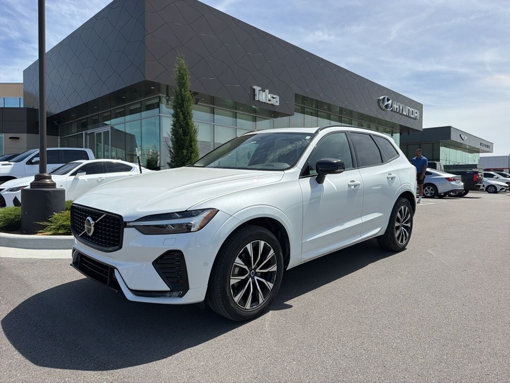2024 Volvo XC60 B5 Plus Dark Theme in Crystal White — front three-quarter view